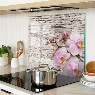 Üveg vágódeszka Orchideák fa háttéren