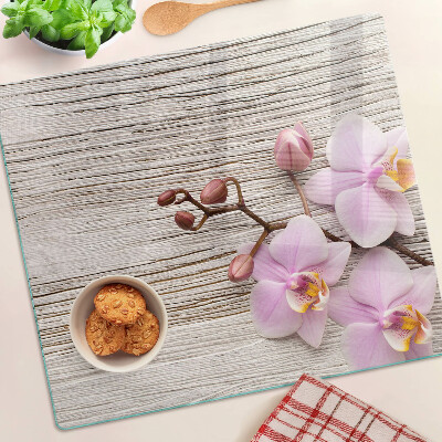 Üveg vágódeszka Orchideák fa háttéren
