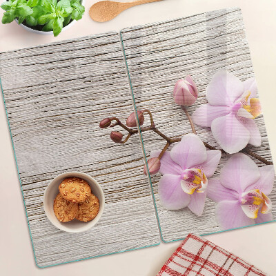 Üveg vágódeszka Orchideák fa háttéren