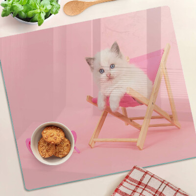 Üveg vágódeszka Cica egy nyugágyon rózsaszín háttér előtt