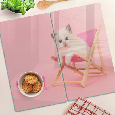 Üveg vágódeszka Cica egy nyugágyon rózsaszín háttér előtt