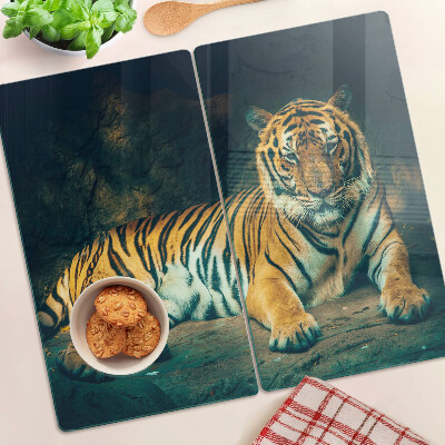 Edzett üveg vágódeszka Tigris fekszik a sziklákon