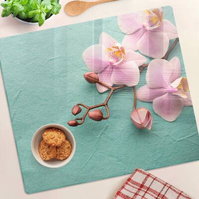 Edzett üveg vágódeszka Orchideák kék háttérrel