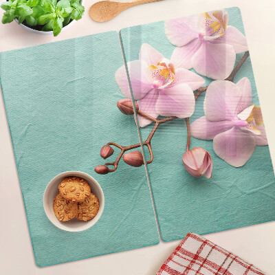 Edzett üveg vágódeszka Orchideák kék háttérrel
