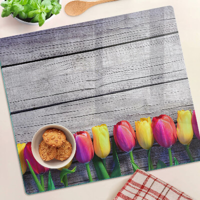 Üveg vágódeszka Tulipánok fa háttéren