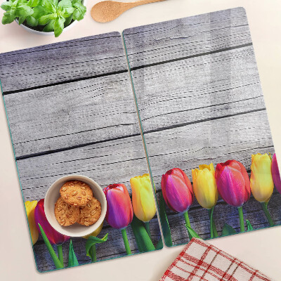 Üveg vágódeszka Tulipánok fa háttéren
