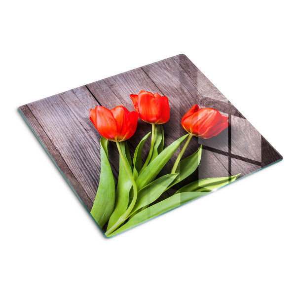 Üveg vágódeszka Tulipánok fa háttéren