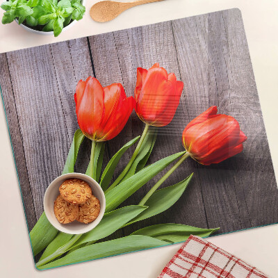Üveg vágódeszka Tulipánok fa háttéren