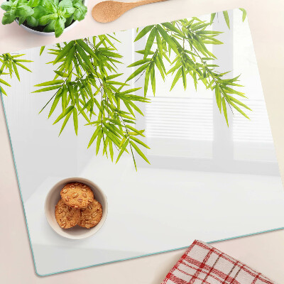 Üveg vágódeszka Bambusz levelek az ablak hátterén