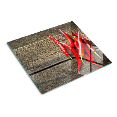 Üveg vágódeszka Chili paprika fa háttéren