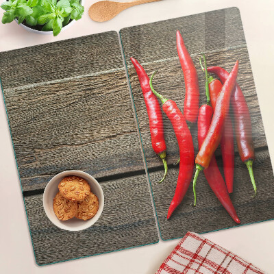 Üveg vágódeszka Chili paprika fa háttéren