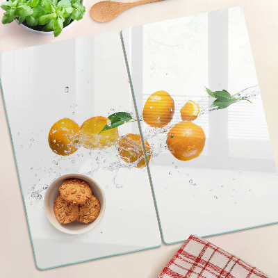Üveg vágódeszka Citrusfélék vízzel