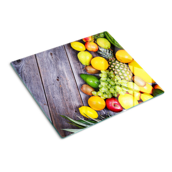 Üveg vágódeszka Gyümölcsök fa háttéren