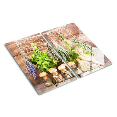 Üveg vágódeszka Fűszerek és gyógynövények fa háttéren