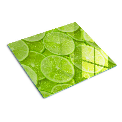 Üveg vágódeszka Lime szeletek zöld háttéren