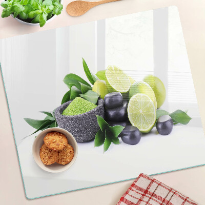 Üveg vágódeszka Citrom és szőlő zöld háttéren