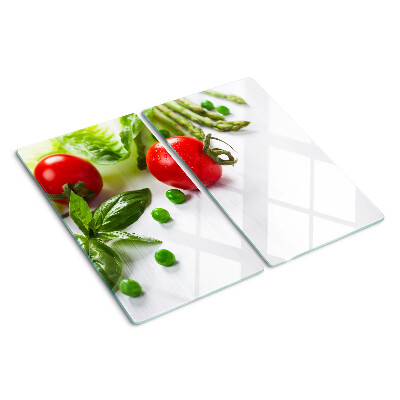 Üveg vágódeszka Zöldségek egy fehér konyhapulton