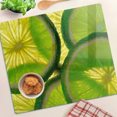 Edzett üveg vágódeszka Lime szeletek zöld háttéren