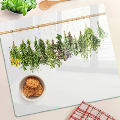 Edzett üveg vágódeszka Szárított gyógynövények egy madzagon