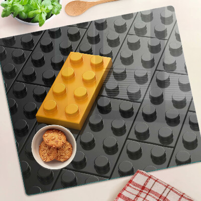 Üveg vágódeszka LEGO kockák fekete háttéren