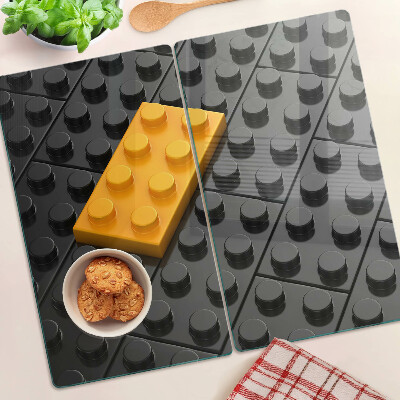 Üveg vágódeszka LEGO kockák fekete háttéren