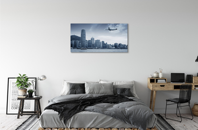 Canvas képek Repülőgép felhők város
