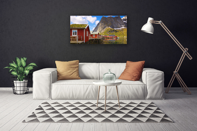 Vászonkép falra Házak tó hegyek táj