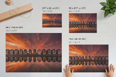 Poszter Színes házak a vízparton a naplemente fényében